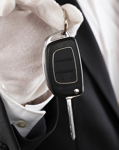 closeup of valet hand holding car key